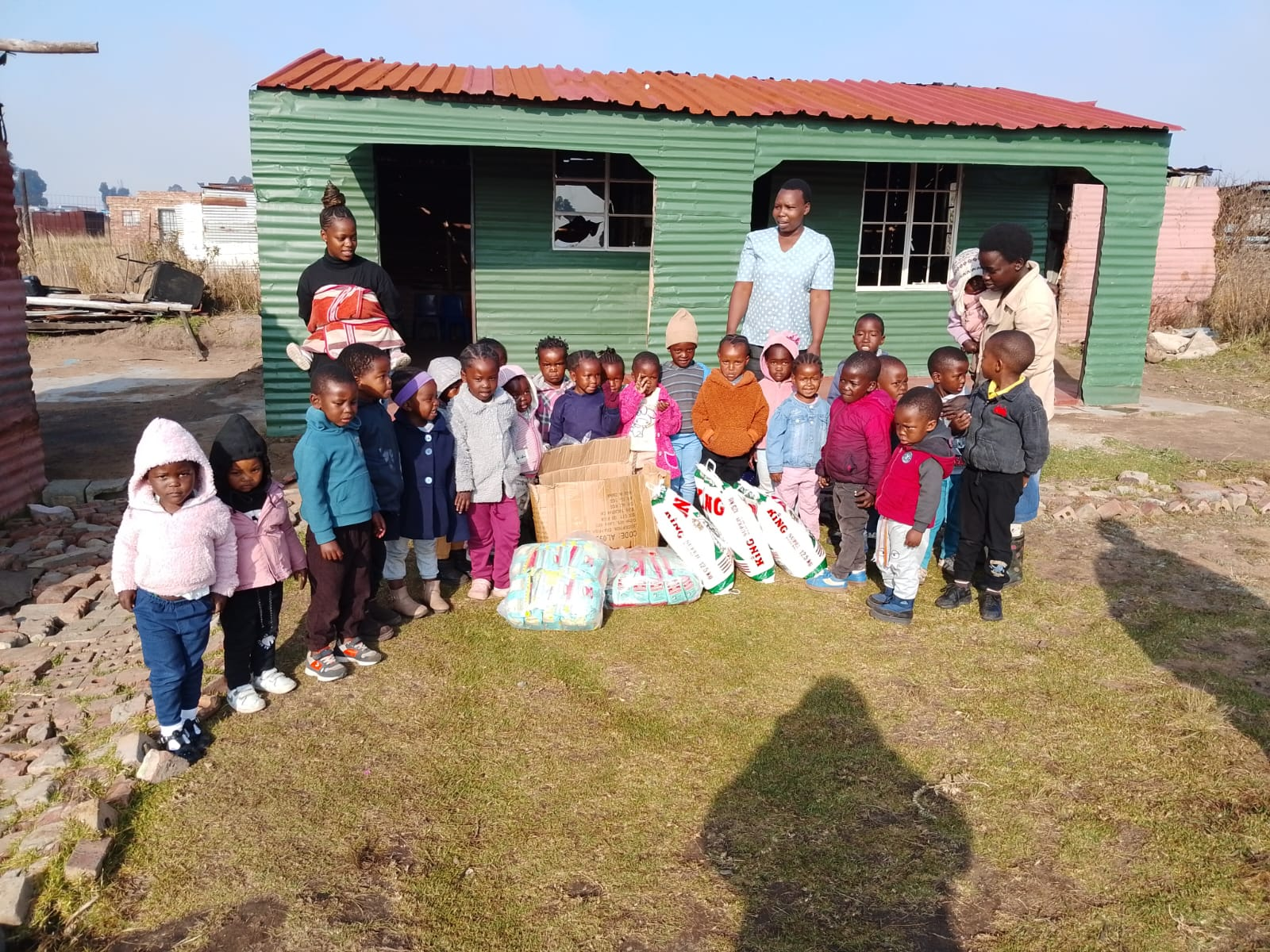 Children and carers at Nkanyezi Yokukhanya Day Care Centre in Mubuza