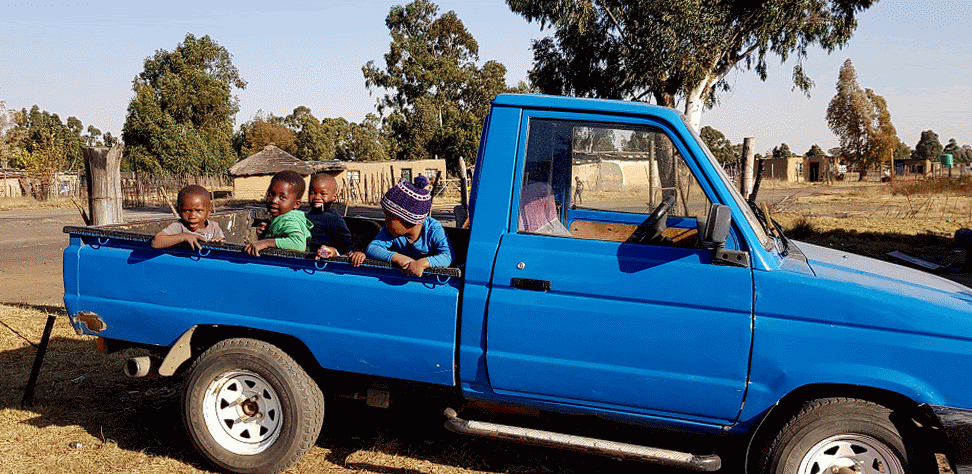 Children playing in a truck in the holidays