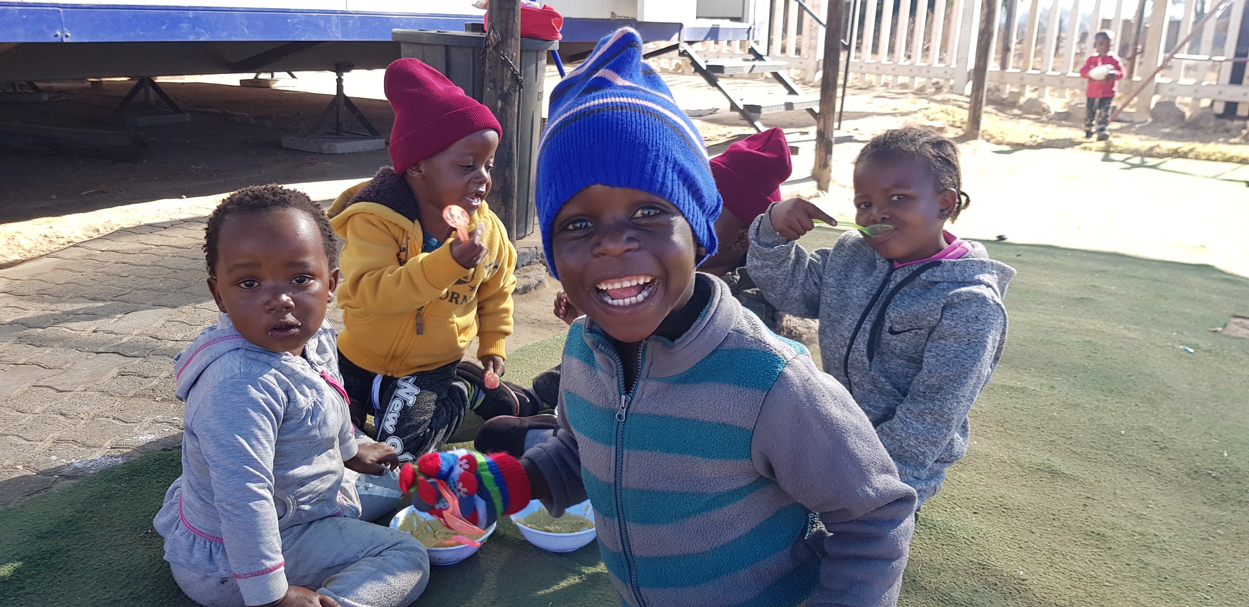 Children eating breakfast in the winter